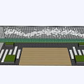 Decorative Perforated Feature Wall In Outdoor Square With Green Trees And People Walking