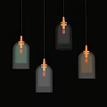 Stylish Colorful Glass Pendant Lights With Gold Accents Hanging On Dark Background