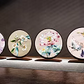 Four Piece Chinese Embroidered Round Decorative Ornament Set with Floral Bird Patterns