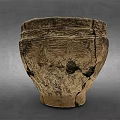 Antique Cracked Ceramic Jar With Intricate Carved Patterns And Worn Texture