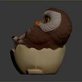 Brown And White Owl Figurine In Egg Shell With Green Accent And Yellow Eyes