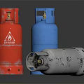 Red Blue And Silver Gas Cylinders As Storage Containers On Black Surface