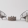 Wicker Leisure Chairs With White Cushions And Round Coffee Table