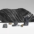 Large Textured Black Stone with Smaller Stones and Natural Wooden Blocks
