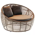 Round Rattan Outdoor Sofa With Dark Cushions And Light Brown Seat Design