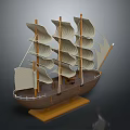 Wooden Sailing Ship Model With Multiple White Sails On Display Base