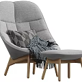Comfortable Modern Pink Accent Chair With Quilted Backrest Blue Pillow And Fringe Blanket