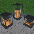 Three Abstract Floor Lamps Featuring Geometric Pattern Shades Outdoor Green Hedge Stone Pavement