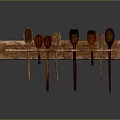 Wooden Kitchen Utensil Set With Various Spoons Hanging On Wooden Board