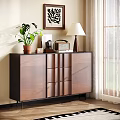 Modern Walnut Dresser with Green Plant Table Lamp and Wall Art