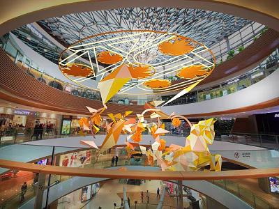 Modern Shopping Mall Interior With Large Orange Geometric Hanging Decorations And Glass Curtain Walls 3d model
