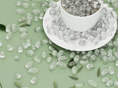 Transparent Pebbles In White Cup On Plate With Green Background And Scattered Leaves 3d model
