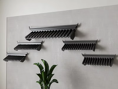 Multiple Black Roof Tile Shaped Wall Decor Arranged On Gray Wall With Green Plant 3d model