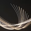 Sleek Modern Chandelier with Artistic Flowing Curved Illuminated Lines for Interior Decor