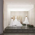 Bridal Shop Interior With Wedding Dress Mannequins On Steps Flower Bouquets And Lighting