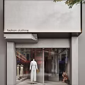 Fashion Clothing Storefront With Gray Facade Glass Window And White Mannequins