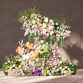 Artistic Floral Display Featuring Various Colorful Flowers Greenery And Three Dimensional Design