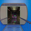 Blue Background Tunnel Entrance With Metal Rail Walkway And Interior Signs