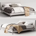 Modern Double Bed With Upholstered Headboard Neutral Pillows And Beige Blanket
