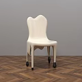 White Single Chair With Unique Backrest Design And Wheeled Legs On Herringbone Wooden Floor
