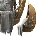 Wicker Hanging Chair With Intricate Pattern Cozy Pillows And Plaid Blanket For Home Interior