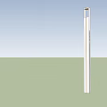 Tall Columnar Outdoor Light Glowing At Base In Open Ground Under Cloudy Night Sky