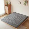 Comfortable Gray Mattress With Wavy Texture On Wooden Bed Frame In Simple Bedroom