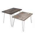 Two Wooden Top Metal Leg Stools Against Grey Wall On Wooden Floor