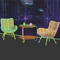 Two Yellow Woven Chairs And Small Round Table In Modern Indoor Setting With Lit Background