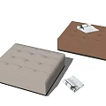 Beige and Brown Tufted Upholstered Ottoman Footstool with Magazine on Light Background