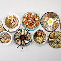 Assorted Food Dishes on White Background with Noodles Meat Seafood and Eggs