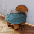 Mushroom Shaped Single Chair With Blue Cushion Brown Backrest And Legs On Wooden Floor