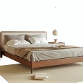 Modern Double Bed with Gray White Pillows Brown Blanket Nightstands Vase on Light Colored Rug