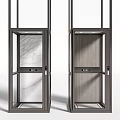 Two Modern Elevators With Glass Doors Metal Frames And Interior Marble Wood Grain Finishes