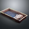 Brown Rectangular Decorative Basin With Water And Pebble Stones As Garden Feature