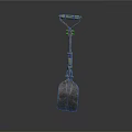 Decorative Metal Shovel With Green Red Accents And Ornate Handle Design