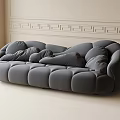 Unconventional Shape Gray Sofa With Plush Cushions In Modern Living Room With Wall Molding