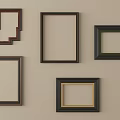 Various Picture Frames With Different Colors And Styles Mounted On Beige Wall 3d model