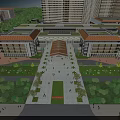 Aerial view of modern hospital building with greenery surrounding trees and multiple structures