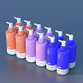 Assorted Colored Pump Bottles in Orange Purple and Blue Arranged in a Row