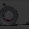 Gray Cable Reel With Coiled Cable Plug And Socket For Home Use