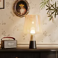 Vintage Table Lamp With Soft Light Lampshade On Table Near Retro Radio And Floral Wallpaper