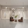 Elegant Bridal Shop Showroom With Hanging Wedding Dresses Cozy Chairs And Green Plants