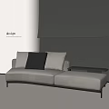 Modern Gray Sectional Sofa With Black And Gray Cushions In Minimalist Living Room