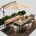 Outdoor Wooden Table On Patio With Beige Umbrella Green Plants And Chairs