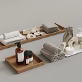 Organized Bathroom Essentials With Rolled Towels On Wooden Trays And Toiletries