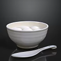 White Bowl With Glutinous Rice Balls And White Spoon On Dark Background