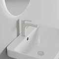 Modern White Washbasin with Sleek Faucet Round Mirror and Clean White Wall Design