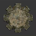 Ancient Circular Ruin Structure Featuring Weathered Moss Covered Stone Blocks And Recessed Areas