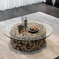 Round Glass Top Coffee Table With Natural Pebble Base And Modern Design